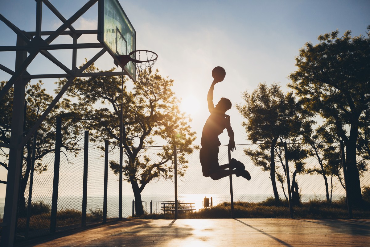black-man-doing-sports-playing-basketball-sunrise-jumping-silhouette (1)