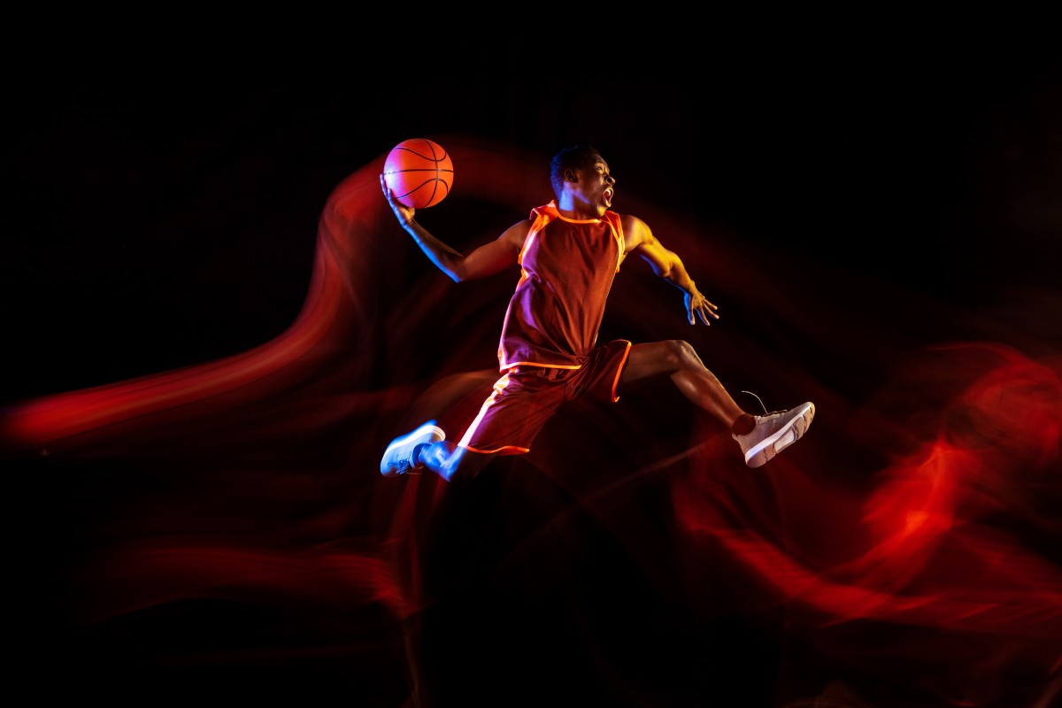 emotions-winner-african-american-young-basketball-player-red-team-action-neon-lights-dark-studio-background-concept-sport-movement-energy-dynamic-healthy-lifestyle (1)