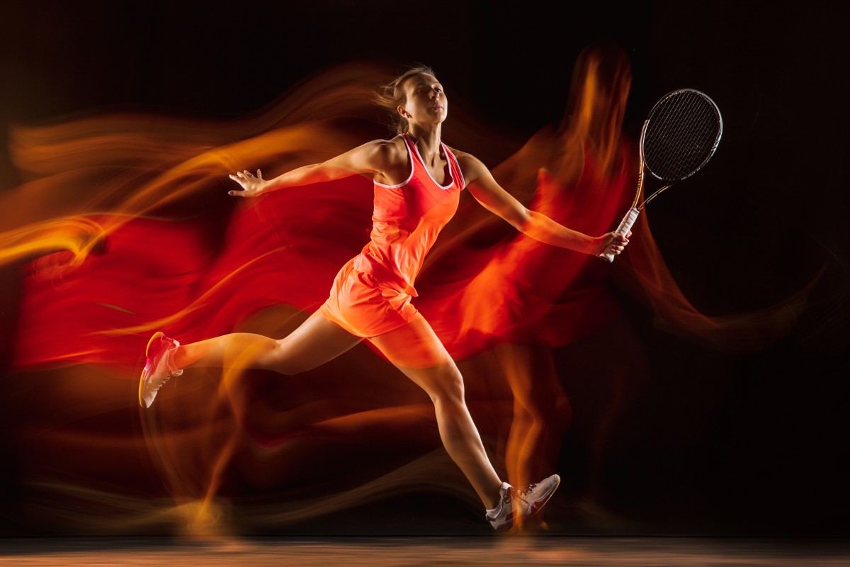professional-female-tennis-player-training-isolated-black-studio-background-mixed-light-woman-sportsuit-practicing (1)